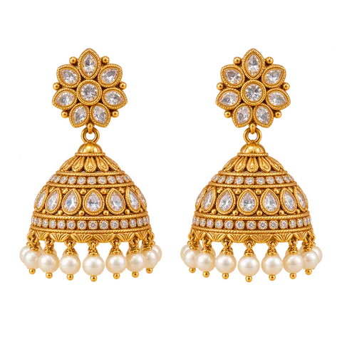 A pair of gold jhumka earrings with pearls.